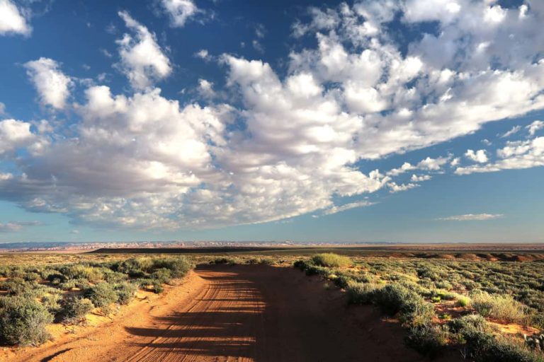 desert land clouds on blue sky